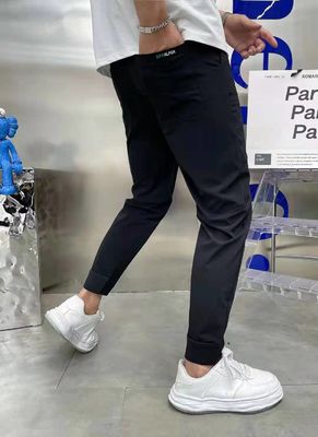 Flat Front Style Pantaloni da carico maschile In stock con bottoni personalizzati Corridori di fitness sciolti