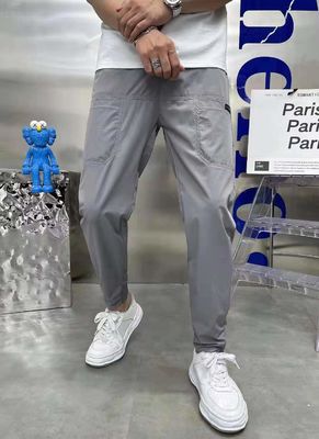 Flat Front Style Pantaloni da carico maschile In stock con bottoni personalizzati Corridori di fitness sciolti