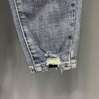 Pantaloni da disegnatore per uomini jeans pantaloni snelli per uomini tagliati articoli in stock